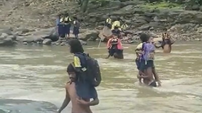 School children in Nashik's Peth taluka cross river every day to reach school. (ANI)