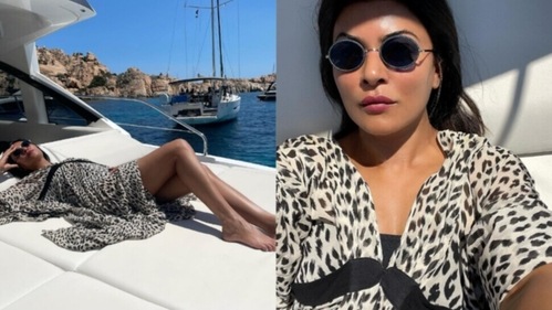 She wore a black and white printed dress and also wore sunglasses. She wore a black and white printed dress and also wore sunglasses.