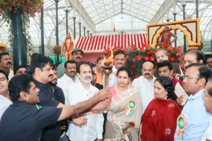 Rajkumar brothers Shivrajkumar and Raghavendra Rajkumar among others like CM Bommai lighting the inaugural flame. (Image source: @MunirathnaMLA/Twitter) Rajkumar brothers Shivrajkumar and Raghavendra Rajkumar among others like CM Bommai lighting the inaugural flame. (Image source: @MunirathnaMLA/Twitter)