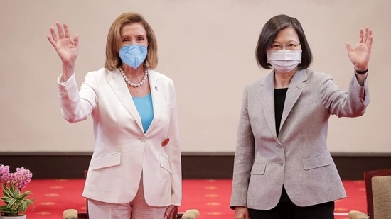 US House Speaker Nancy Pelosi (left) waving beside Taiwan's President Tsai Ing-wen at the Presidential Office in Taipei, on Wednesday. (AFP)