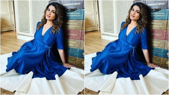 Raveena decked up in a satin blue long dress featuring a wrapped detail and a plunging neckline with a tie-around at the waist.(Instagram/@officialraveenatandon)