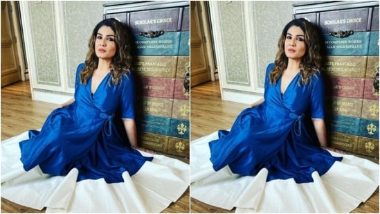 The dress cascaded featuring long flowy details and a thick white border at the ankles. The dress also featured loose pleat details below the waist.(Instagram/@officialraveenatandon)