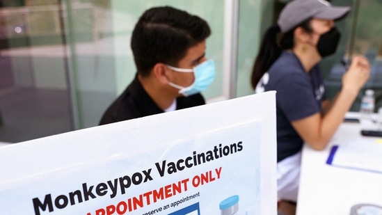 (FILES) In this file photo taken on August 3, 2022 health workers sit at a check-in table at a pop-up monkeypox vaccination clinic which opened today by the Los Angeles County Department of Public Health at the West Hollywood Library in West Hollywood, California. -(AFP)