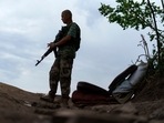 Ukrainian soldier Igor Ryazantsev with the Dnipro-1 regiment keeps watch outside his tent during a period of relative calm around their position near Sloviansk, Donetsk region, eastern Ukraine, Friday, Aug. 5, 2022.(AP) Ukrainian soldier Igor Ryazantsev with the Dnipro-1 regiment keeps watch outside his tent during a period of relative calm around their position near Sloviansk, Donetsk region, eastern Ukraine, Friday, Aug. 5, 2022.(AP)