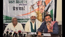 Samyukt Kisan Morcha leaders Hannan Mollah, Yogendra Yadav and Rakesh Tikait address a press conference in New Delhi, Saturday. (PTI)
