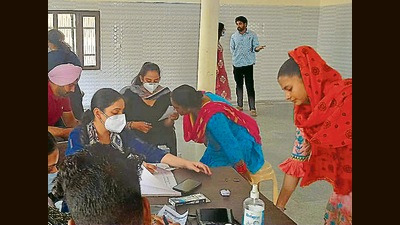 New Mohindra Colony residents at the medical camp set up in view of the diarrhoea in the locality in Patiala, on Saturday. (HT Photo)