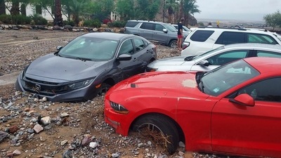 Cars are stuck in mud and debris from flash flooding at The Inn at Death Valley in Death Valley National Park, Calif., Friday, Aug. 5, 2022. (AP) Cars are stuck in mud and debris from flash flooding at The Inn at Death Valley in Death Valley National Park, Calif., Friday, Aug. 5, 2022. (AP)