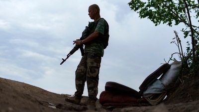Ukrainian soldier Igor Ryazantsev with the Dnipro-1 regiment keeps watch outside his tent during a period of relative calm around their position near Sloviansk, Donetsk region, eastern Ukraine, Friday, Aug. 5, 2022. (AP) Ukrainian soldier Igor Ryazantsev with the Dnipro-1 regiment keeps watch outside his tent during a period of relative calm around their position near Sloviansk, Donetsk region, eastern Ukraine, Friday, Aug. 5, 2022. (AP)