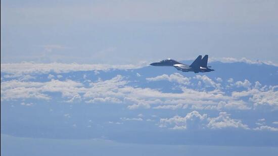 A Chinese military plane flies during a training exercise of the air force corps of the Eastern Theatre Command of the People’s Liberation Army (PLA),on Friday. (AP)