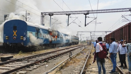 Smoke billows from a train coach after it was set on fire by demonstrators during a protest against the 'Agnipath' defence recruitment scheme in Bihar in June. (Santosh Kumar/ HT File Photo)