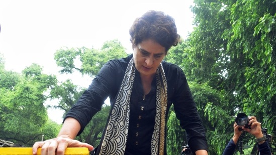Congress leader Priyanka Gandhi Vadra jumps over a police barricade placed near AICC HQ during the party's nationwide protest over price rise and unemployment.(ANI)