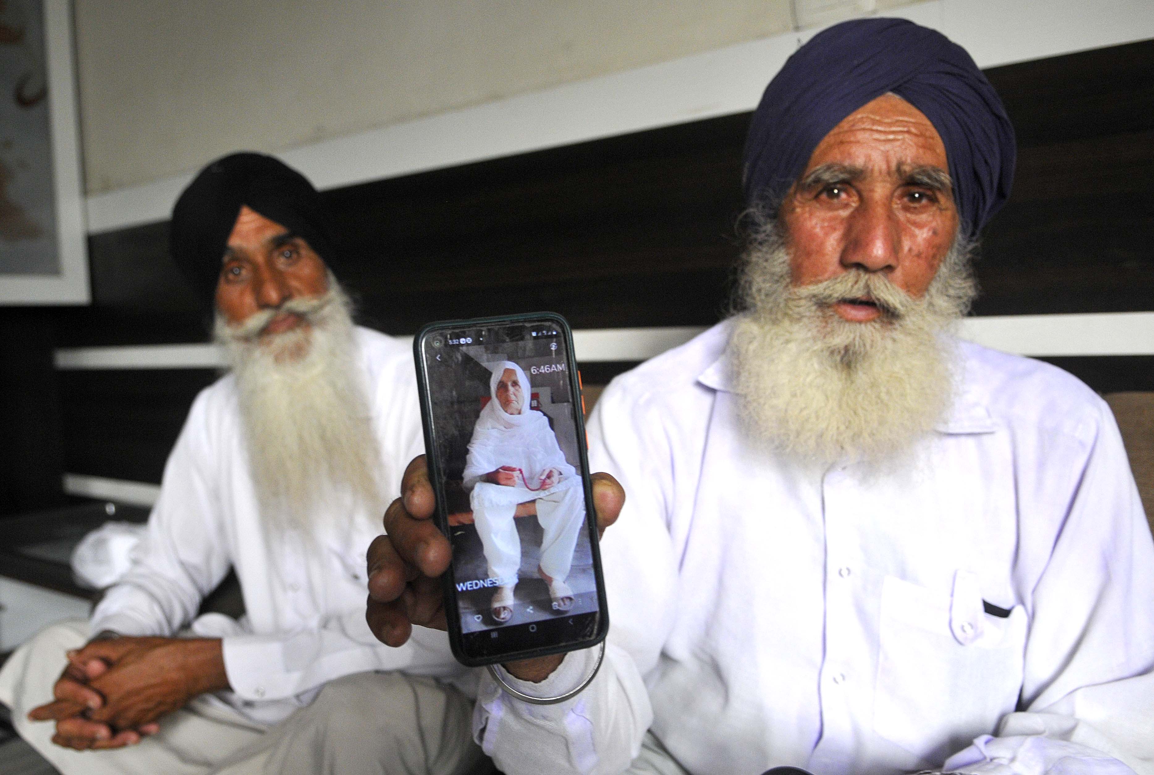 STRANGER THAN FICTION: Gurmukh Singh and Baldev Singh of Shutrana village in Patiala district with the picture of their sister Mumtaz Bibi on the phone as they get ready to visit her at Sheikhupura come December. (Keshav Singh/HT) STRANGER THAN FICTION: Gurmukh Singh and Baldev Singh of Shutrana village in Patiala district with the picture of their sister Mumtaz Bibi on the phone as they get ready to visit her at Sheikhupura come December. (Keshav Singh/HT)
