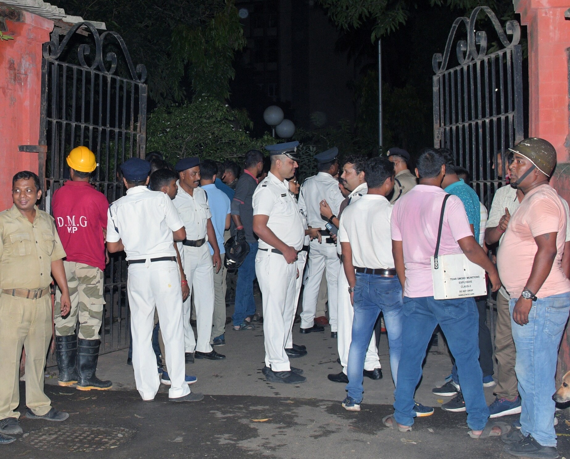 Police and paramilitary personnel stand at the incident site where (Central Industrial Security Force) CISF Constable opened fire which resulted in the death of a person, at the Indian Museum, in Kolkata on Saturday. (ANI Photo) (Saikat Paul)