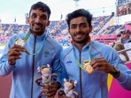 Men's triple jump gold medalist Eldhose Paul, right, of India stands with silver medalist and compatriot Abdulla Aboobacker Narangolintevida, left, (AP) Men's triple jump gold medalist Eldhose Paul, right, of India stands with silver medalist and compatriot Abdulla Aboobacker Narangolintevida, left, (AP)