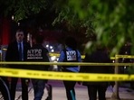 New York Police Department (NYPD) officers investigate a crime scene. New York Police Department (NYPD) officers investigate a crime scene.