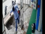 A screengrab from the video that shows the man's narrow escape as the footpath caves in. (Reddit/@CAEmotionalEkambaram) A screengrab from the video that shows the man's narrow escape as the footpath caves in. (Reddit/@CAEmotionalEkambaram)