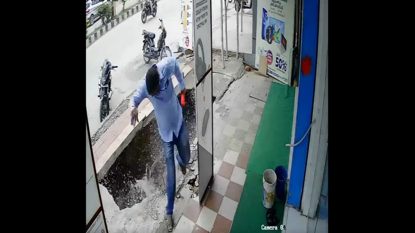 Man's narrow escape as footpath caves in goes viral. Watch jaw-dropping video