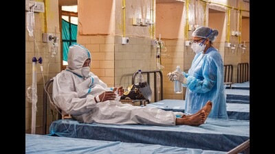 A healthcare worker inspects a suspected monkeypox patient in India. (PTI Photo) A healthcare worker inspects a suspected monkeypox patient in India. (PTI Photo)