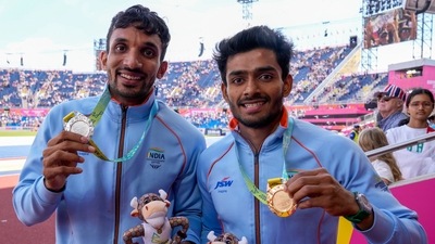 Men's triple jump gold medalist Eldhose Paul, right, of India stands with silver medalist and compatriot Abdulla Aboobacker Narangolintevida, left,&nbsp; (AP)