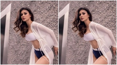 Mouni decked up in the bikini and added more drama to her look with a long white satin shrug as she posed for the pictures. (Instagram/@imouniroy)