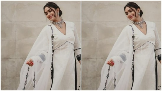 Mrunal further accessorised her look for the day in statement silver earrings with embedded white stones. She also added a silver neck choker with white embedded stones.(Instagram/@mrunalthakur)