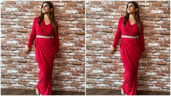 Raveena’s full-sleeved gown featured wrap details in one shoulder and put together with a silver belt at the waist. The gown hugged Raveena’s shape and showed off her curves.(Instagram/@officialraveenatandon)