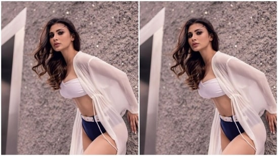 Mouni decked up in the bikini and added more drama to her look with a long white satin shrug as she posed for the pictures.(Instagram/@imouniroy)