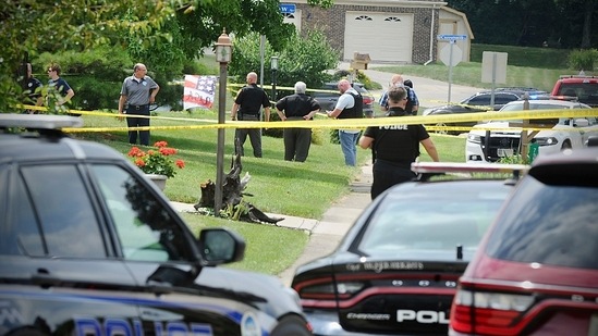 Police investigate a shooting Friday, Aug. 5, 2022, in Butler Township, Ohio. Authorities say four people were shot to death in the Ohio suburb and a man considered armed and dangerous is being sought. (Marshall Gorby /Dayton Daily News via AP)(AP)