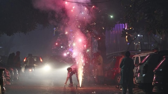 People burst fire crackers on Diwali in New Delhi. (Sanchit Khanna/HT Photo)