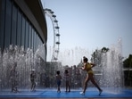 Children cool off in a water fountain during a heatwave, in London, Britain. (File)