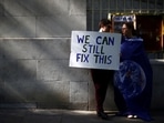 People attend a climate change demonstration in London, Britain, (REUTERS/Hannah McKay/File Photo)
