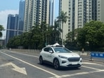 A car of Baidu's autonomous ride-hailing service platform Apollo Go drives on a street in Shenzhen, Guangdong province.