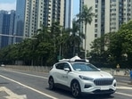 A car of Baidu's autonomous ride-hailing service platform Apollo Go drives on a street in Shenzhen, Guangdong province.