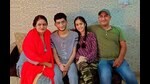 Ludhiana’s Aryaman Angurman, who secured AIR 197 in JEE Main, celebrating with his family on Monday.