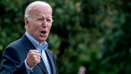 US President Joe Biden answers a shouted question from a reporter while walking to Marine One on the South Lawn of the White House in Washington, DC, on August 7, 2022, as he travels to Rehoboth Beach, Delaware. 