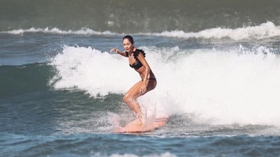 When not with her family or children, Lisa Haydon makes the most of her time on the beach by skateboarding. 