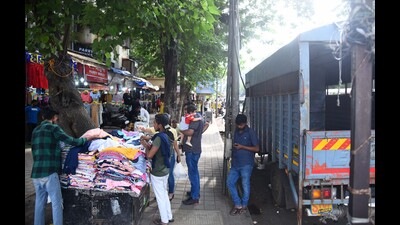 Hawkers encroach the footpaths at Hill Road (HT PHOTO) Hawkers encroach the footpaths at Hill Road (HT PHOTO)