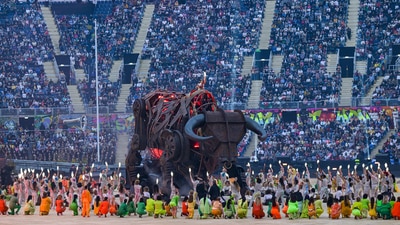 Artists perform near a giant mechanical raging bull during the opening ceremony of Commonwealth Games 2022 (PTI) Artists perform near a giant mechanical raging bull during the opening ceremony of Commonwealth Games 2022 (PTI)