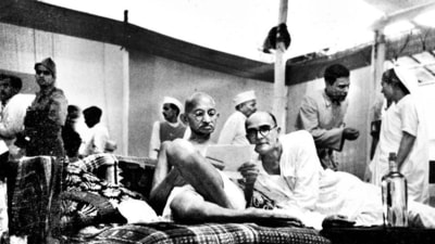 Gandhi with Mahadev Desai (right) at the All India Congress Committee meeting in Bombay, August 8, 1942, the day that the Quit India resolution was moved. (National) Gandhi with Mahadev Desai (right) at the All India Congress Committee meeting in Bombay, August 8, 1942, the day that the Quit India resolution was moved. (National)