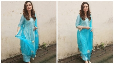 Talking about the design details, Kareena picked a long kurta featuring a round neckline, see-through full-length sleeves, gold patti and taar embroidery, and slits on both sides. (HT Photo/Varinder Chawla) Talking about the design details, Kareena picked a long kurta featuring a round neckline, see-through full-length sleeves, gold patti and taar embroidery, and slits on both sides. (HT Photo/Varinder Chawla)
