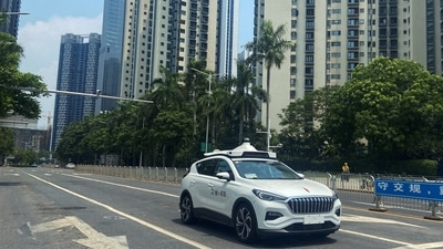A car of Baidu's autonomous ride-hailing service platform Apollo Go drives on a street in Shenzhen, Guangdong province. (REUTERS)