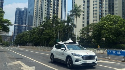 A car of Baidu's autonomous ride-hailing service platform Apollo Go drives on a street in Shenzhen, Guangdong province. (REUTERS)