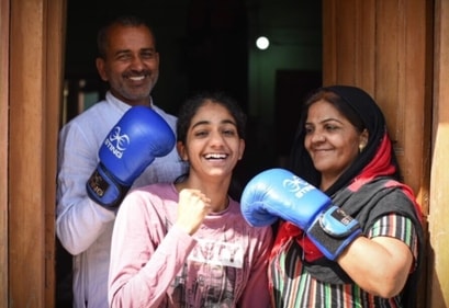 Nitu Ghanghas with her parents (HT Photo) Nitu Ghanghas with her parents (HT Photo)