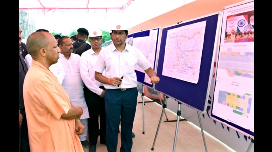 Chief minister Yogi Adityanath during the digital unveiling of the first look of the Agra Metro train. (HT photo)