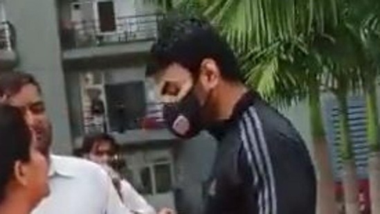 Shrikant Tyagi, who claimed to be a leader of the BJP, was booked by the Noida police after he was seen using abusive language at a resident of his apartment block in Noida. (Video/Screen grab)(HT_PRINT) Shrikant Tyagi, who claimed to be a leader of the BJP, was booked by the Noida police after he was seen using abusive language at a resident of his apartment block in Noida. (Video/Screen grab)(HT_PRINT)