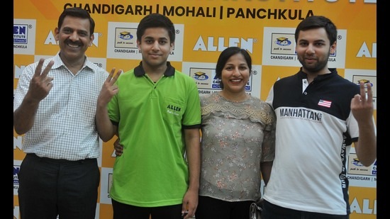 Saarth Singla celebrating his success with his family in Chandigarh on Monday. (Ravi Kumar/HT)