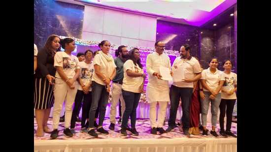 U.P. deputy chief minister Brajesh Pathak with Sheroes at an event in Lucknow on Monday. (HT photo)