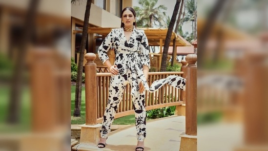 Huma Qureshi elevated her look with elegant pieces of jewellery that comprise a big gold chain choker and stud earrings.(Instagram/@iamhumaq)