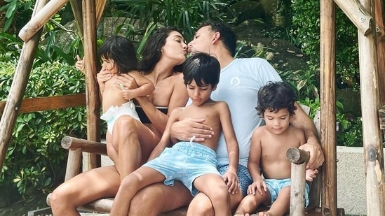 Sharing their latest family photo on Instagram, Lisa Haydon wrote, “Kiss me, quick… before the light changes.” (All images: Lisa Haydon/ Instagram)