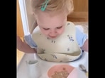 The baby girl gets surprised after pouring milk without spilling it for the first time. (Instagram/@thelittledreameruk) The baby girl gets surprised after pouring milk without spilling it for the first time. (Instagram/@thelittledreameruk)